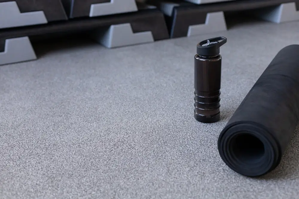 Protective cover rolled over a gymnasium floor