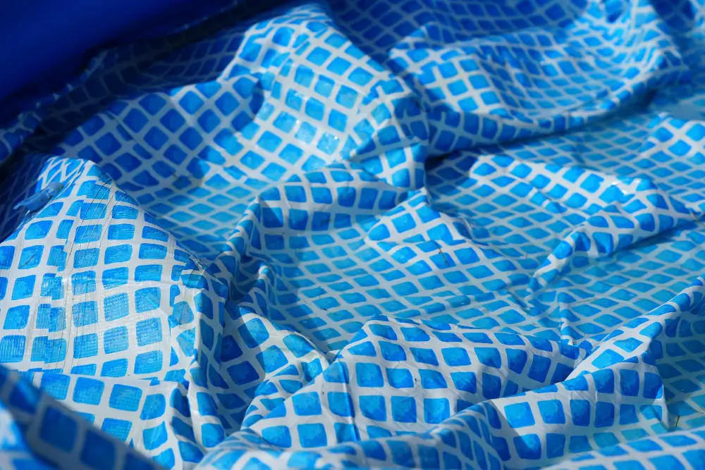 Winter cover stretched over a swimming pool