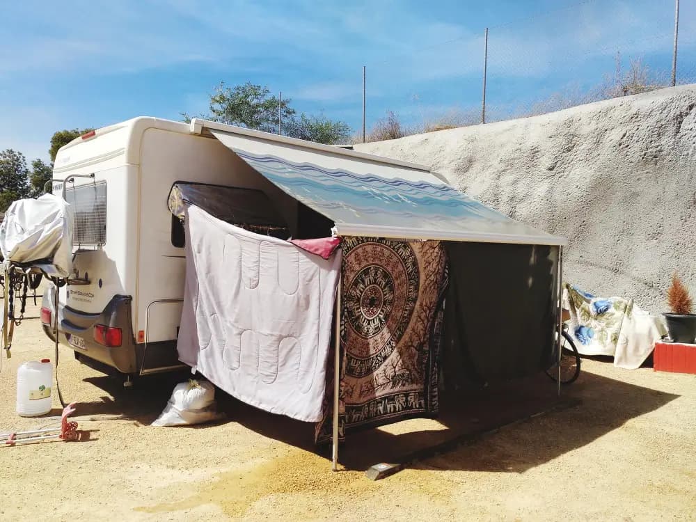 Recreational vehicle under a fitted storage cover