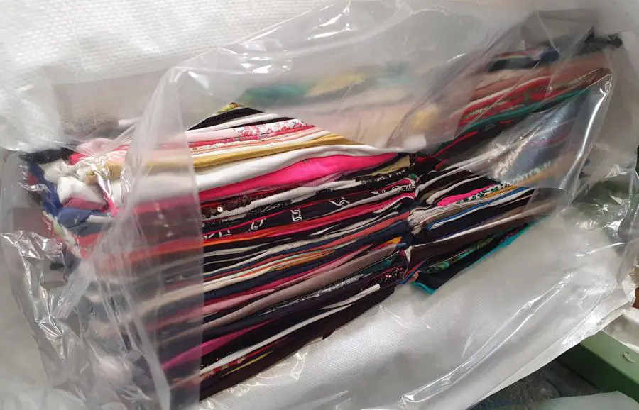 Baled used clothing wrapped in woven polypropylene